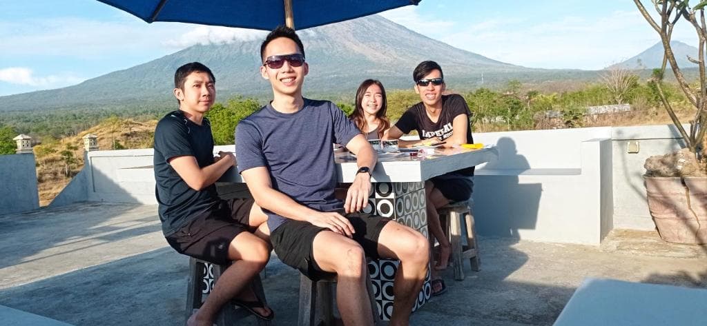 Pool with palm trees at sunrise