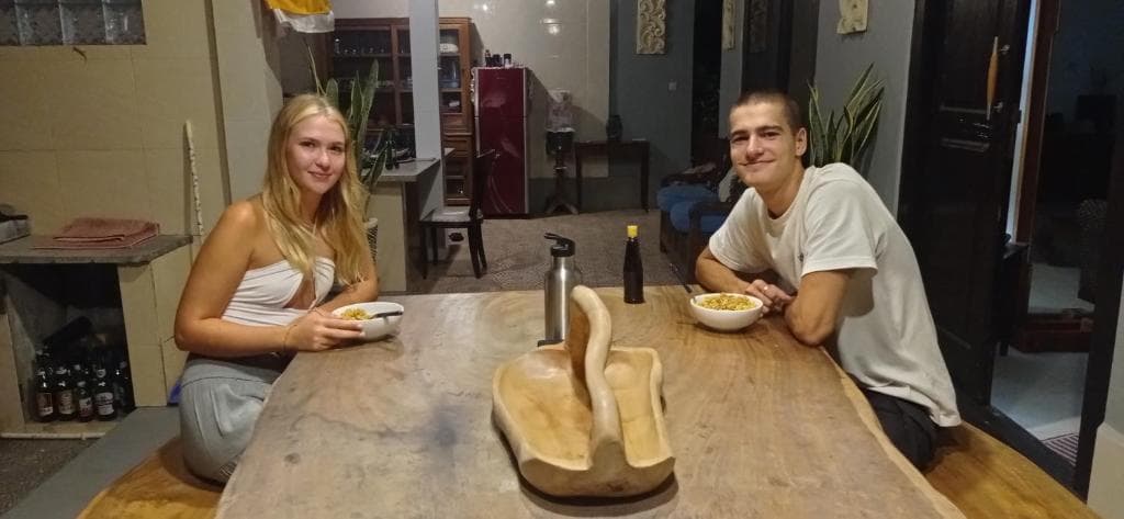 Pool loungers under palm shade